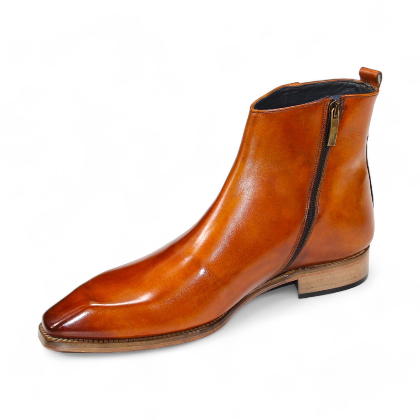 The Duca Di Matiste Romano (Gold) is a brown leather ankle boot with a polished finish and a low wooden heel, crafted from genuine leather. Made in Italy by Duca Di Matiste, these boots offer timeless style and unmatched quality.