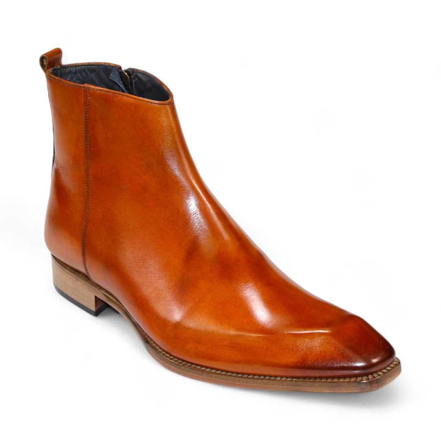 The Duca Di Matiste Romano (Gold) is a brown leather ankle boot with a polished finish and a low wooden heel, crafted from genuine leather. Made in Italy by Duca Di Matiste, these boots offer timeless style and unmatched quality.