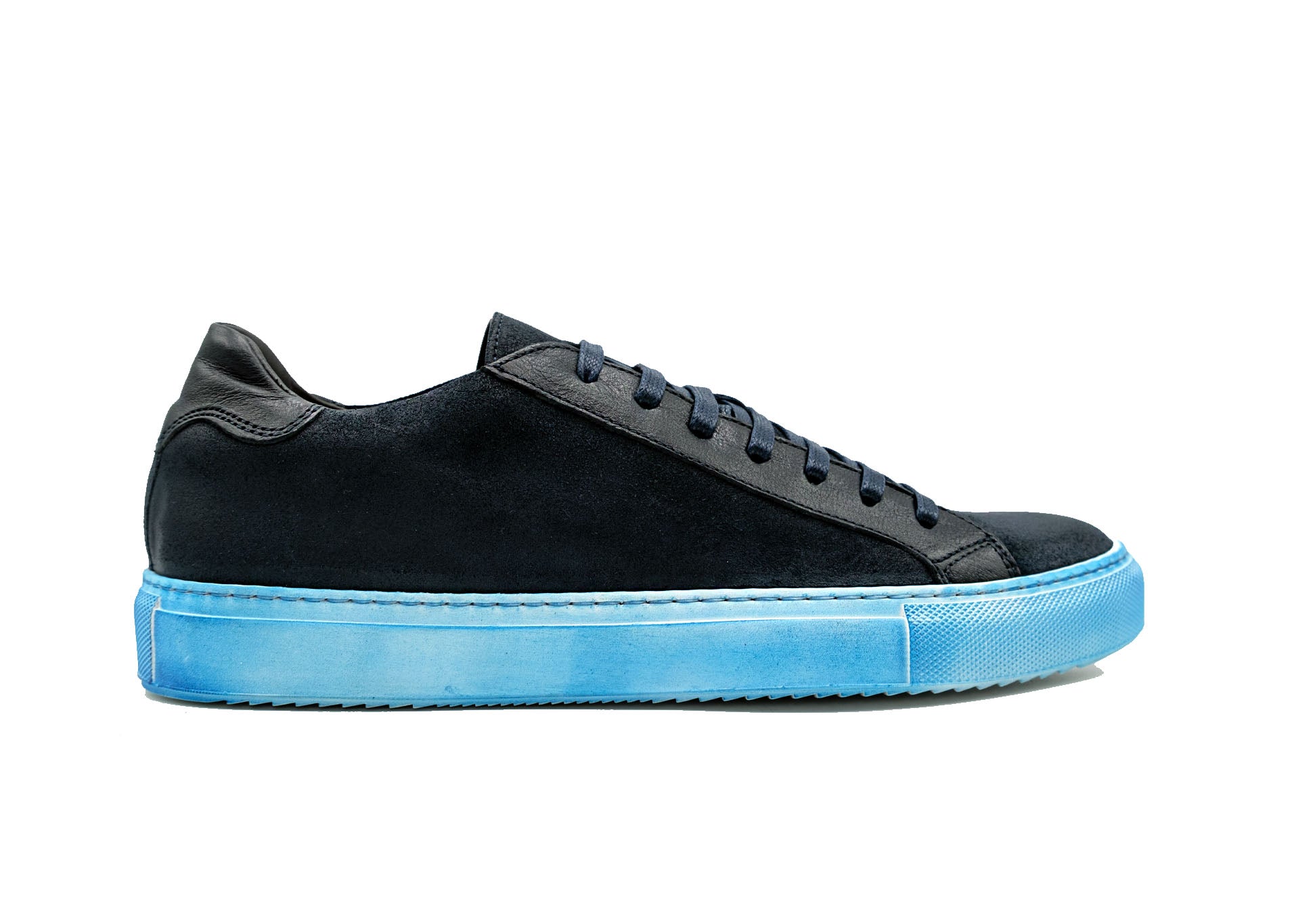 The GIOVACCHINI Rino Antique Blue Suede Calf Sneakers are designed with a sleek black exterior complemented by a blue sole and black laces, featuring a low-top silhouette and expertly crafted in Italy, all showcased against a white background.