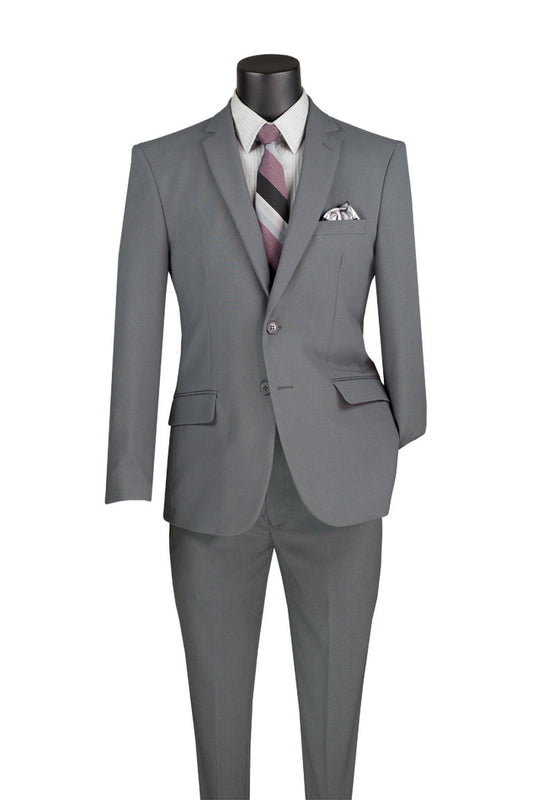 Vinci Suits' Vinci Slim Fit 2 Piece 2 Button Business Suit in medium gray, displayed on a mannequin, comes with a stylish striped tie and pocket square, and includes impeccably tailored pants and blazer.