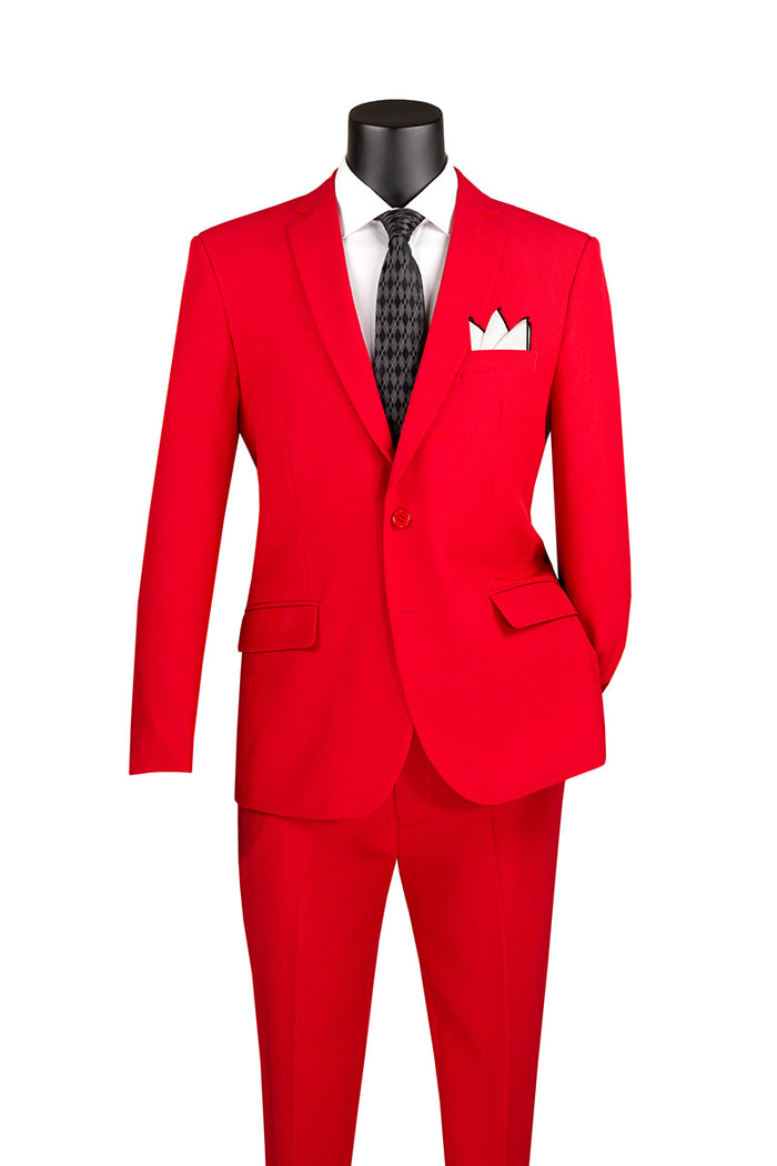 A mannequin elegantly displays the Vinci Slim Fit 2 Piece 2 Button Business Suit in bright red, accented with a black tie and white pocket square, set against a crisp white background.