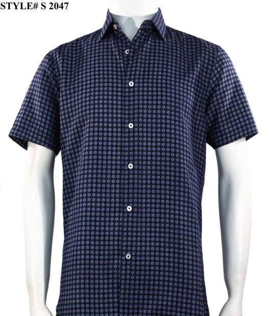 A mannequin displays the Sangi Short Sleeve Shirt, featuring a blue and white geometric pattern that exemplifies contemporary fashion, with the style number "S 2047" visible in the top left corner.