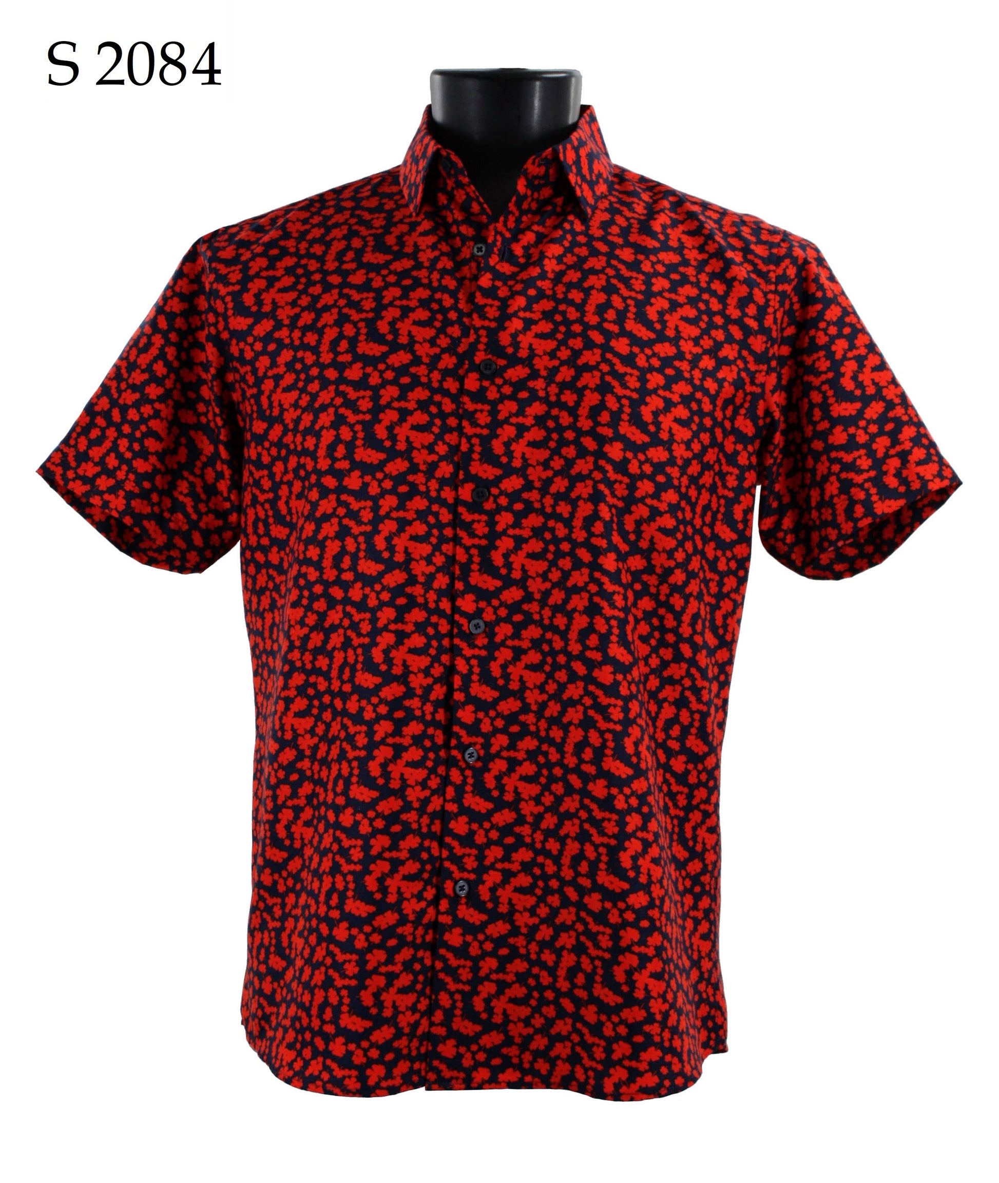 Displayed on a mannequin is the Sangi Short Sleeve Shirt S 2084 by Sangi, featuring a sleek modern fit with its red and black abstract pattern.