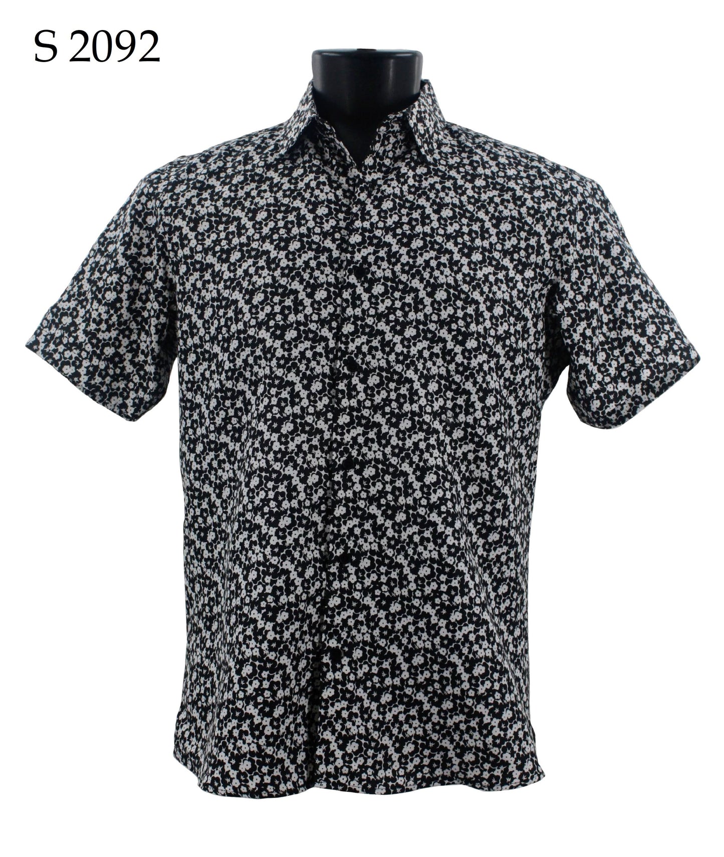 On display is the Sangi Short Sleeve Shirt S 2092, featuring a black and white floral design in a modern fit on a mannequin with the label "S 2092" in the top left corner, making it perfect for elevating your fashion game.