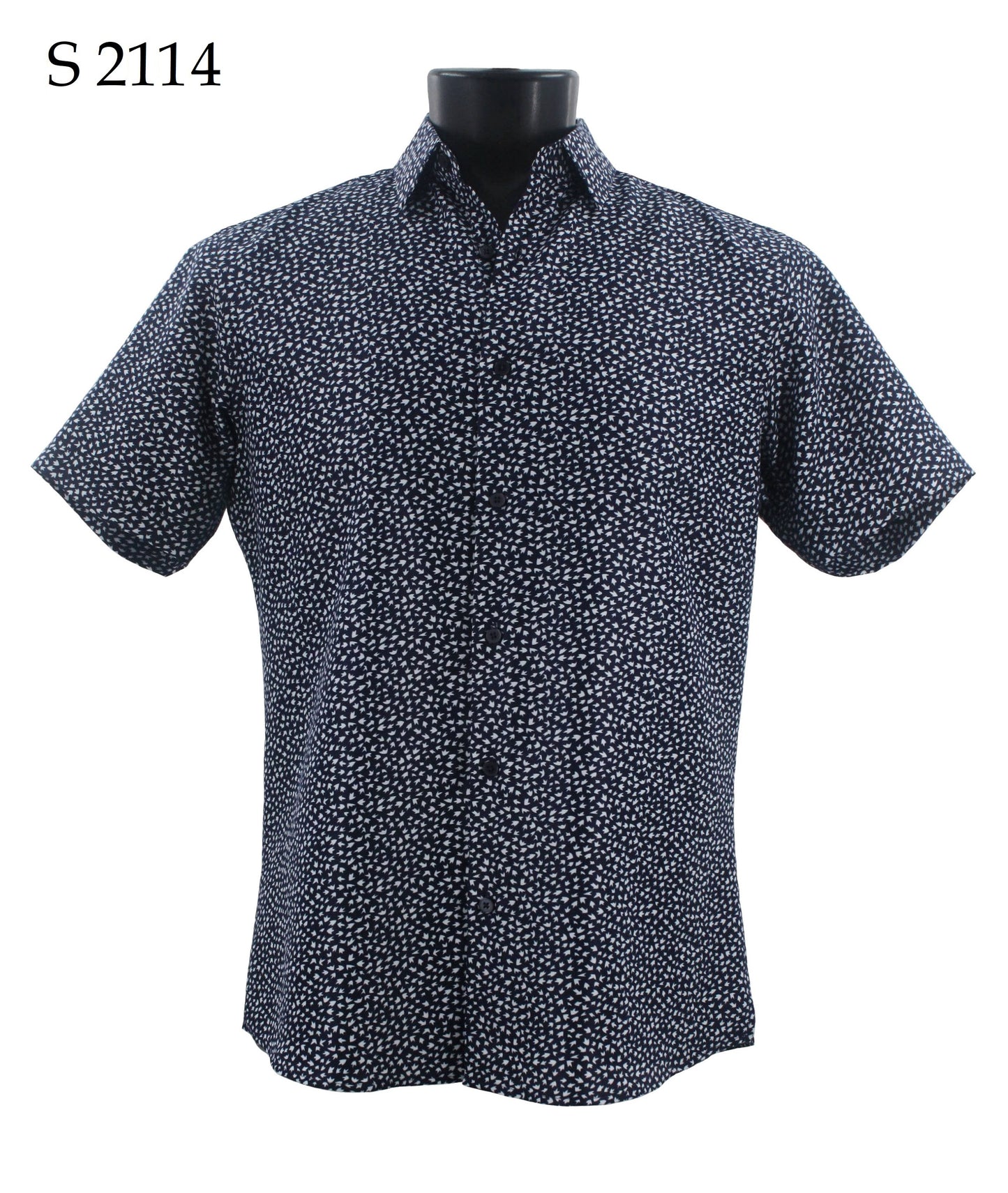 The Sangi Short Sleeve Shirt S 2114 is displayed on a mannequin, highlighting its black and white dotted pattern and button-up design. With a modern fit, this shirt by Sangi combines style and comfort.