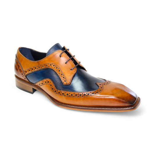 The Duca Di Matiste Saranno (Cognac/Navy) shoes feature exquisite craftsmanship with decorative perforations and a classic lace-up design, proudly made in Italy.