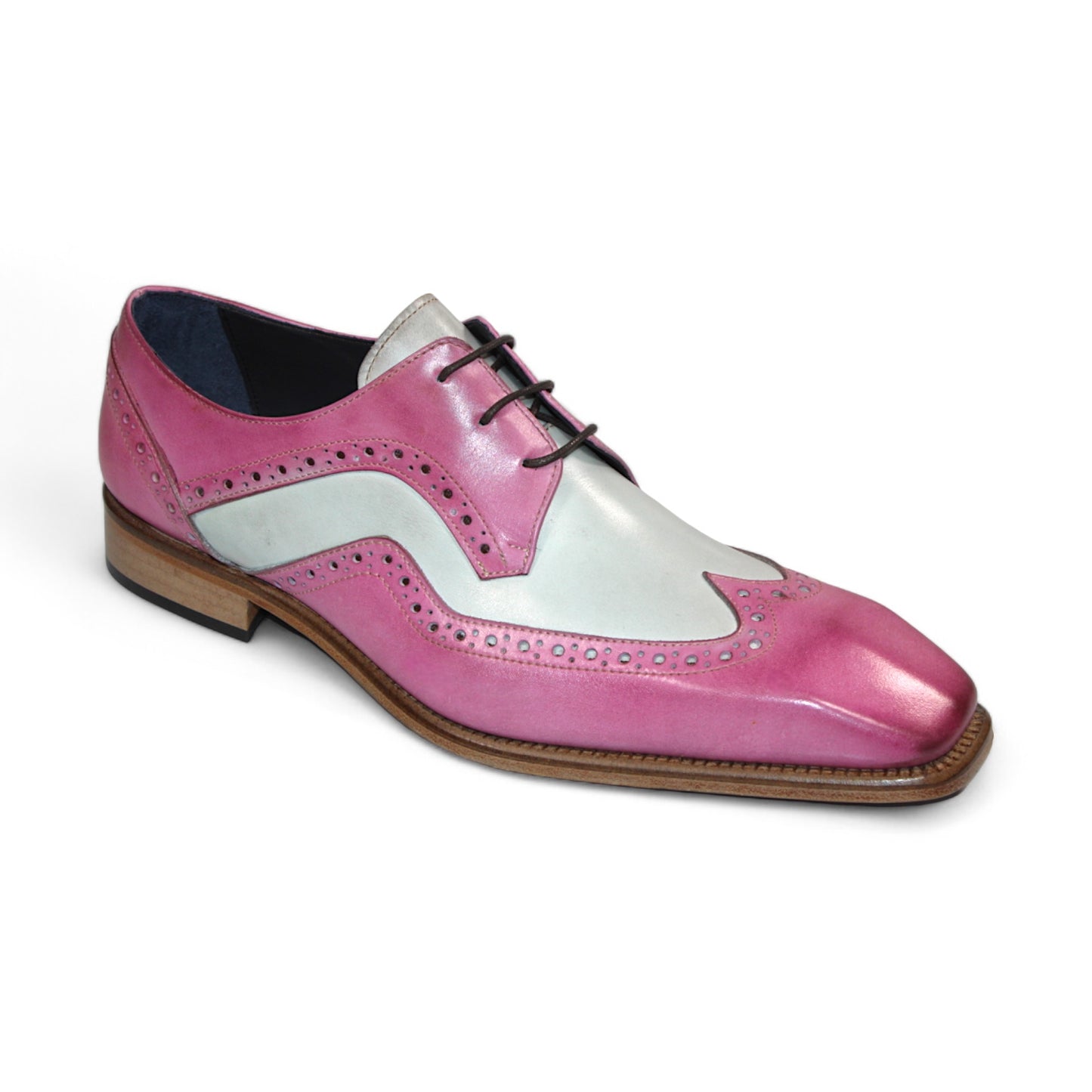 The Duca Di Matiste Saranno (Pink/Bone) is an exquisite men's dress shoe crafted from pink, white, and light brown leather, featuring decorative perforations and black laces. Made in Italy by Duca Di Matiste, it showcases impeccable craftsmanship and style.