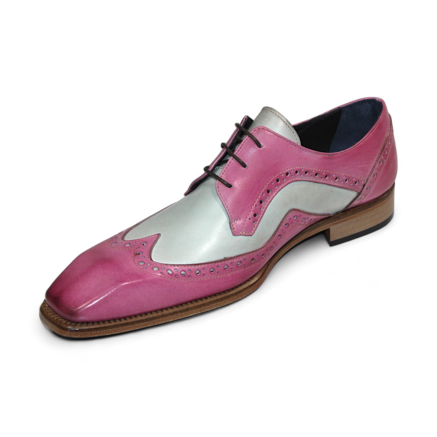 The Duca Di Matiste Saranno (Pink/Bone) is an exquisite men's dress shoe crafted from pink, white, and light brown leather, featuring decorative perforations and black laces. Made in Italy by Duca Di Matiste, it showcases impeccable craftsmanship and style.