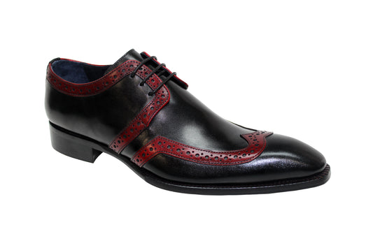 The Duca Di Matiste Savona in Black/Antique Red is a leather dress shoe expertly crafted in Italy. It highlights elegant antique red detailing and perforations, featuring laces and a low heel to blend timeless style with modern craftsmanship.