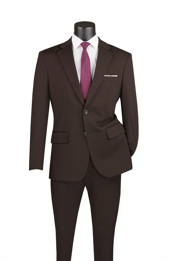 The Vinci Slim Fit 2 Piece Suit in brown, featuring stretch fabric for added comfort and an adjustable waistband for a perfect fit, is displayed on a mannequin. The elegant style is accentuated with a white shirt and red tie, highlighting its sophistication. This stylish ensemble is part of the Vinci Suits collection.