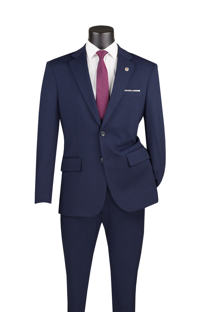 The Vinci Suits mannequin showcases a sleek design, featuring the Vinci Slim Fit 2 Piece Suit Stretch Fabric Suit with Adjustable Waistband in Navy SDX-3, paired with a white dress shirt and a red tie.