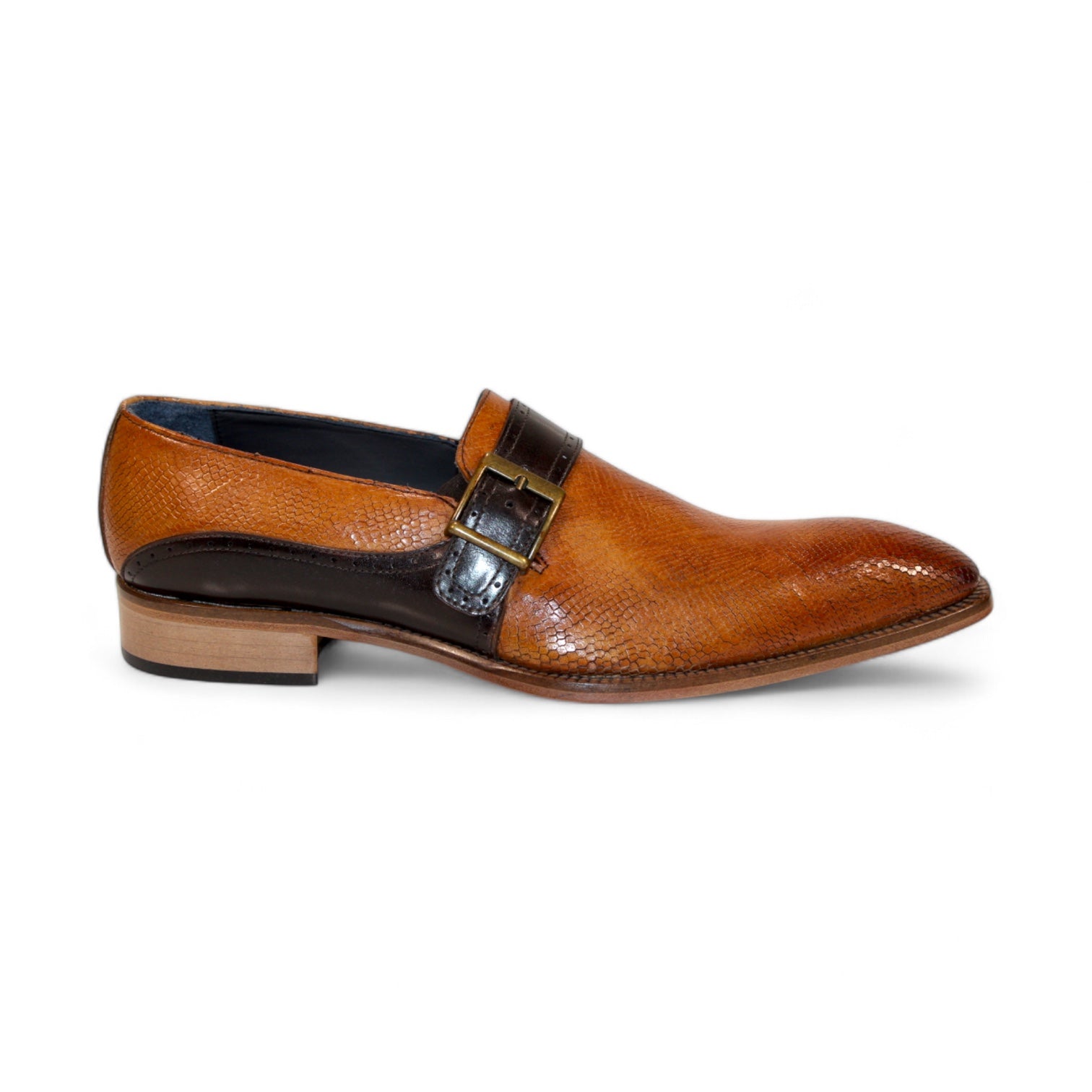 Introducing the Duca Di Matiste Sezze in Cognac and Chocolate: a polished brown leather dress shoe with a sophisticated textured finish, adorned with a sleek black strap and an elegant buckle detail on top. Expertly crafted in Italy by Duca Di Matiste, these shoes embody both sophistication and exceptional quality.