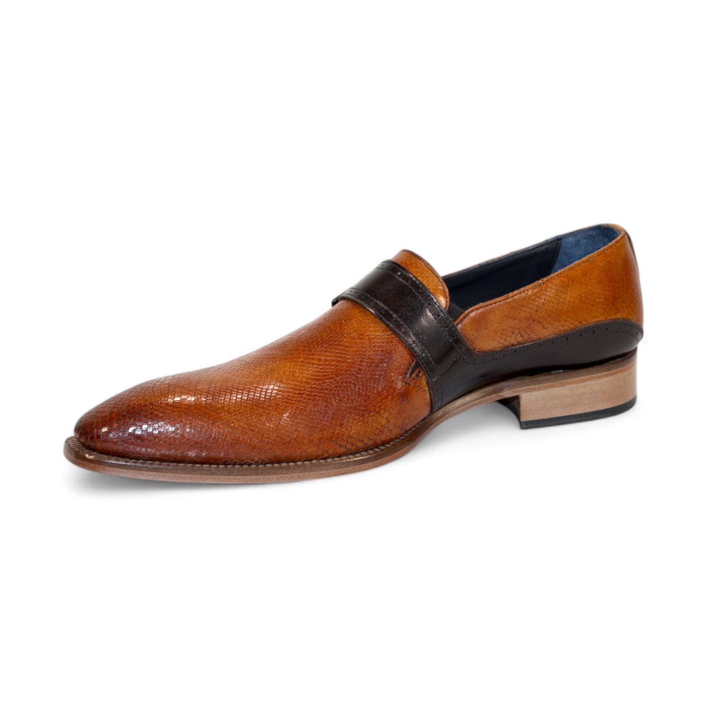 Introducing the Duca Di Matiste Sezze in Cognac and Chocolate: a polished brown leather dress shoe with a sophisticated textured finish, adorned with a sleek black strap and an elegant buckle detail on top. Expertly crafted in Italy by Duca Di Matiste, these shoes embody both sophistication and exceptional quality.