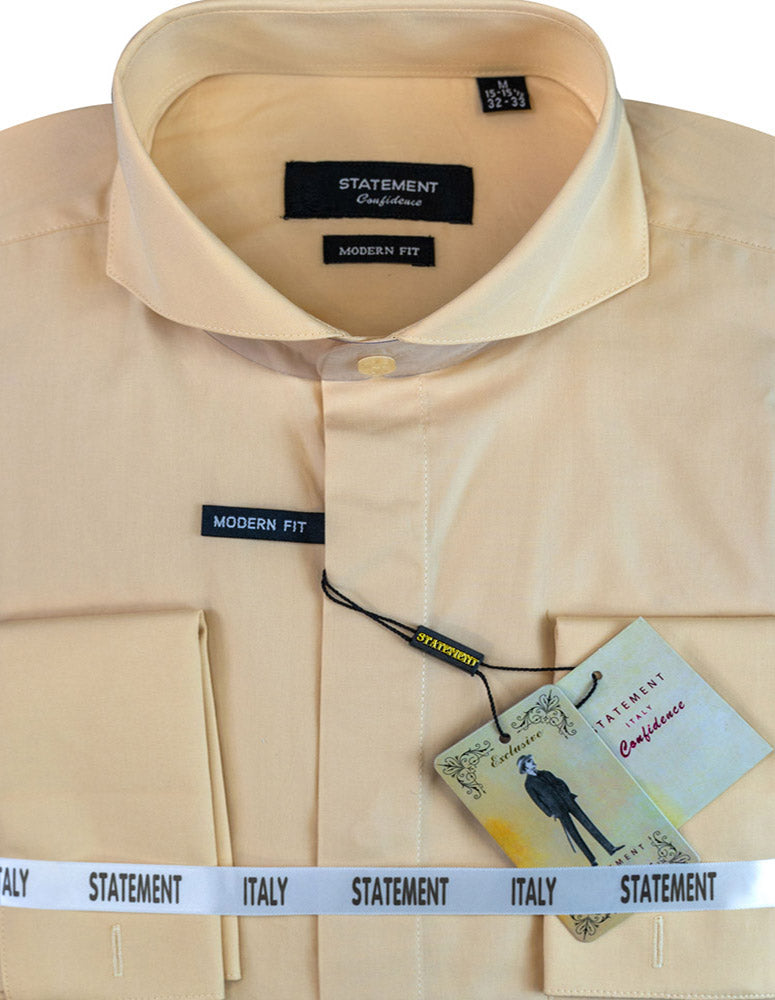 Folded beige cotton dress shirt from Statement Clothing, labeled as the STATEMENT CLOTHING | COTTON SPREAD COLLAR DRESS SHIRT SP-100-TAN. It showcases a sophisticated spread collar and refined French cuffs, while an attached tag proudly features a silhouette graphic.