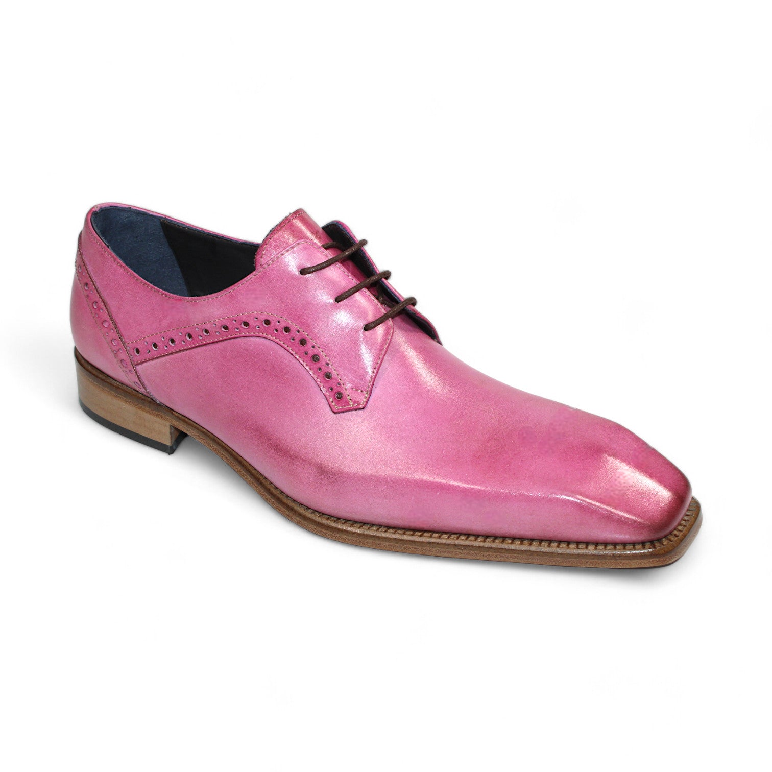 The Duca Di Matiste Spada (Pink) by Duca Di Matiste is a pink leather dress shoe expertly crafted in Italy, featuring a square toe, decorative perforations, and a brown wooden sole.