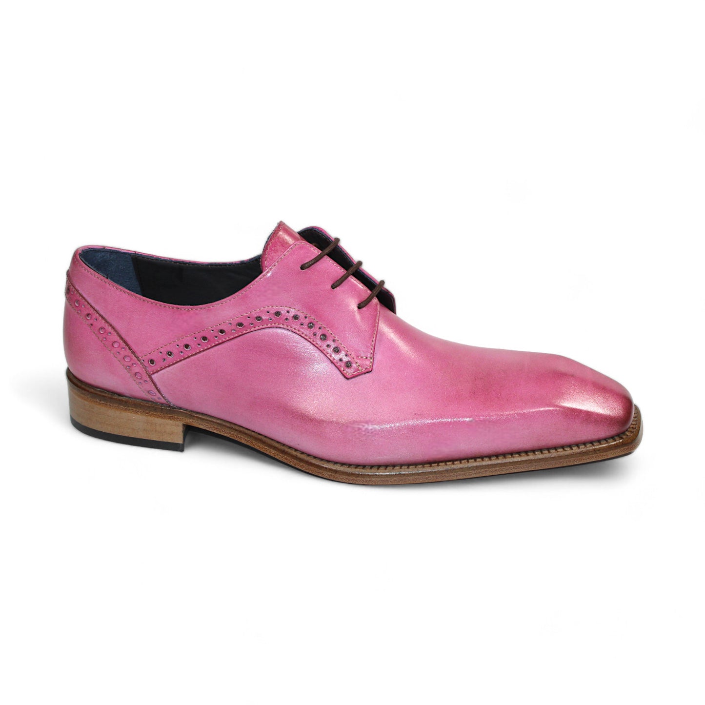 The Duca Di Matiste Spada (Pink) by Duca Di Matiste is a pink leather dress shoe expertly crafted in Italy, featuring a square toe, decorative perforations, and a brown wooden sole.