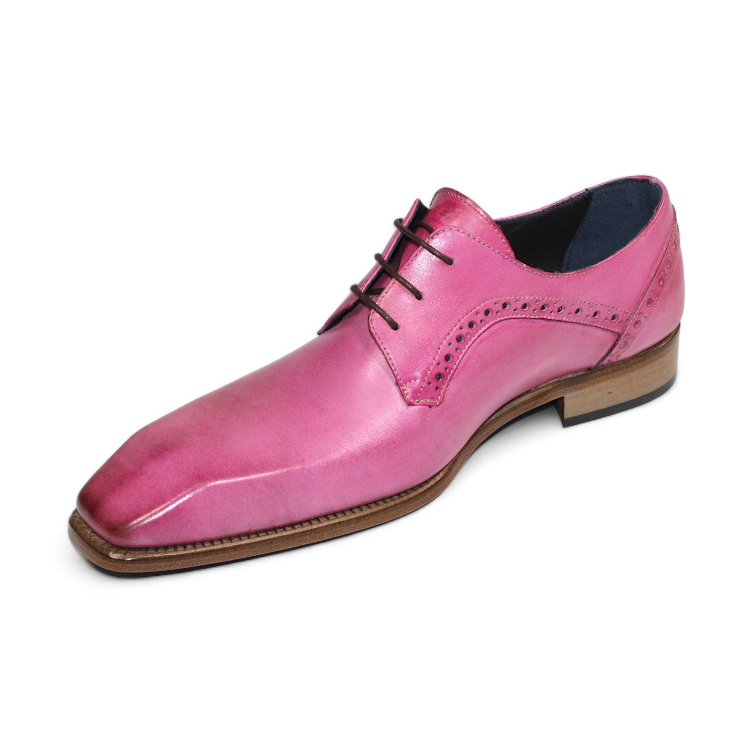 The Duca Di Matiste Spada (Pink) by Duca Di Matiste is a pink leather dress shoe expertly crafted in Italy, featuring a square toe, decorative perforations, and a brown wooden sole.