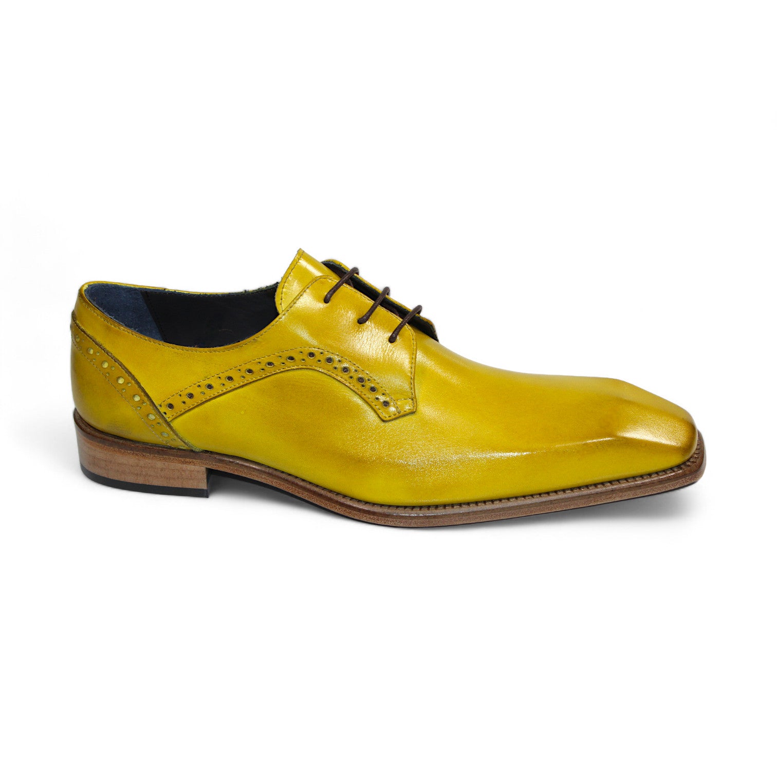 The Duca Di Matiste Spada in yellow is a leather dress shoe featuring brown laces and a wooden heel, adorned with decorative perforations along the sides. Crafted in Italy, these shoes exemplify an ideal combination of craftsmanship and elegance.