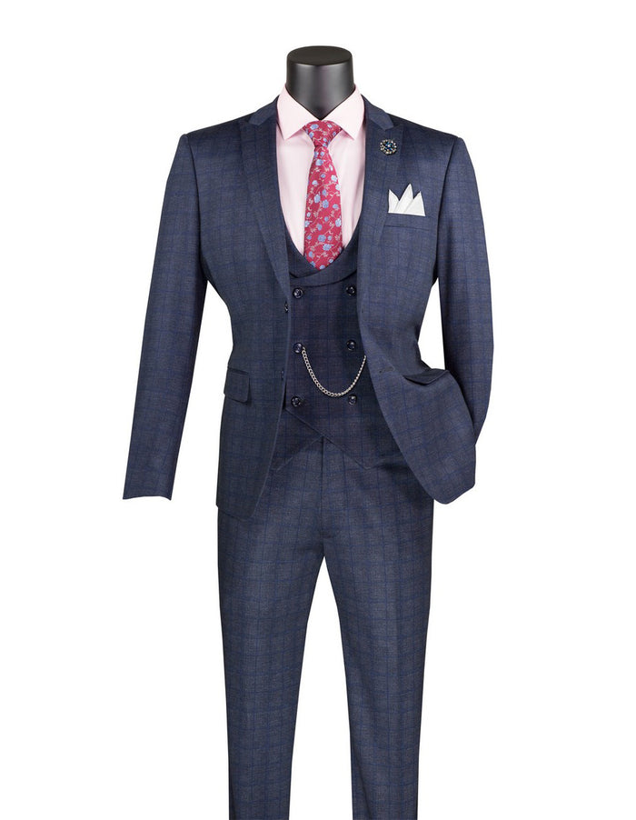 The Vinci Slim Fit 3 Piece Stretch Fabric Suit with Armholes, Navy SV2W-8, from Vinci Suits features a checkered pattern and is designed for comfort. It is elegantly presented on a mannequin with a white pocket square, pink dress shirt, and pink patterned tie.