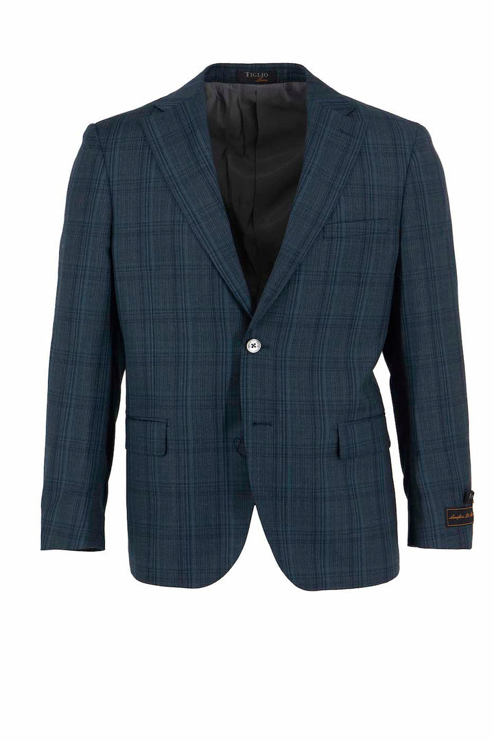 The Tiglio Luxe Blue Windowpane Dolcetto Modern Fit Jacket TL3300 is expertly crafted from pure wool. It features a single button closure, two front pockets, and a notched lapel, embodying Italian sartorial traditions in every stitch.