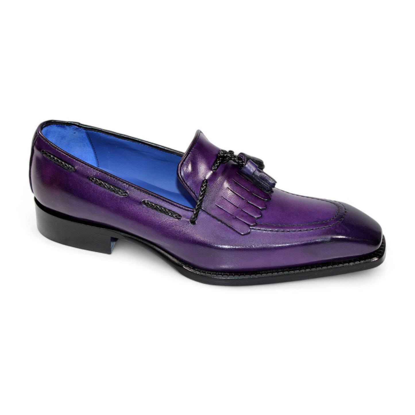 The Emilio Franco "Tommaso" Purple Shoes feature a meticulously crafted single leather loafer with tassel and fringe details, made in Italy. It showcases a striking blue interior lining against a crisp white background.