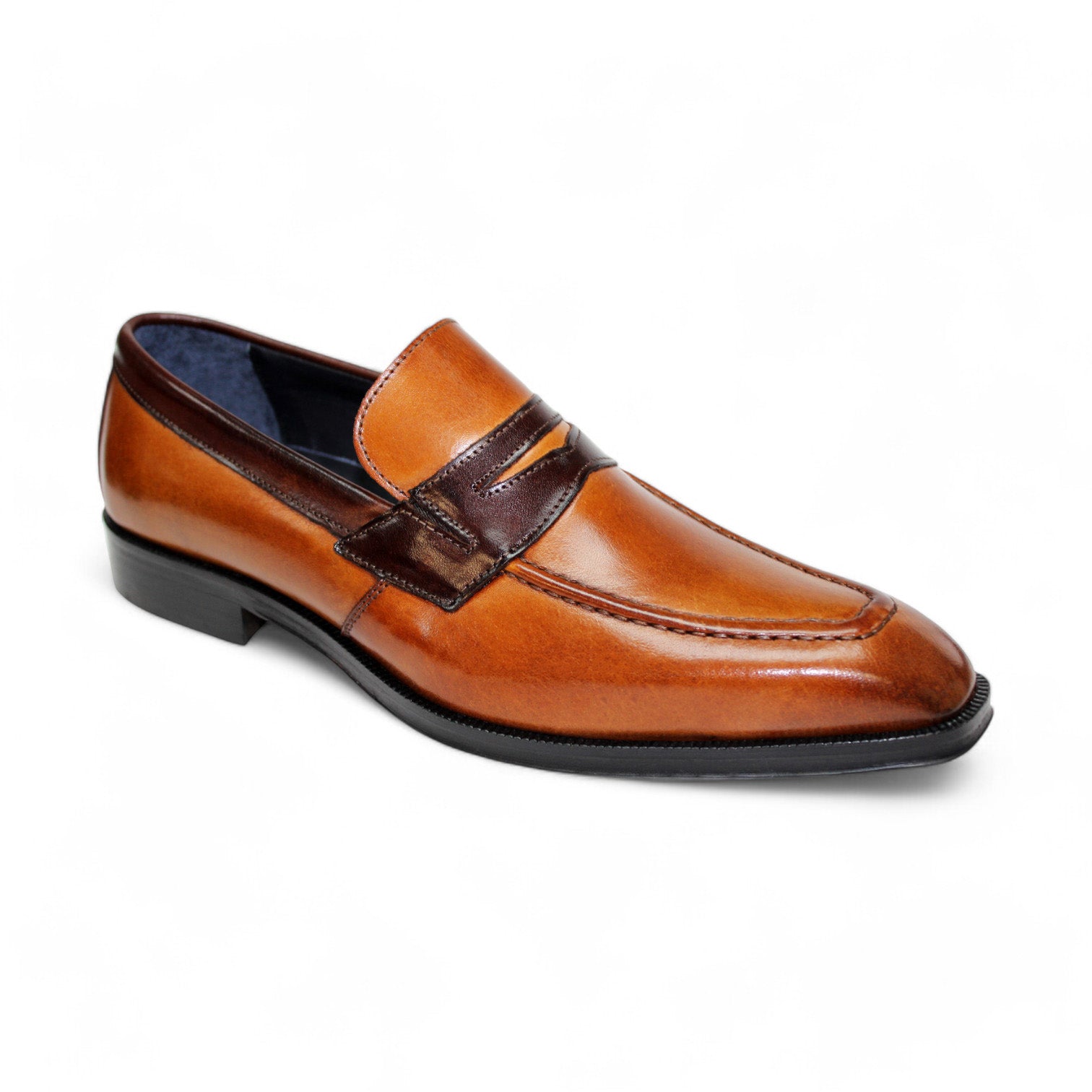 The Firmani Trevor Cognac/Brown Shoes, crafted in Italy, feature a low heel and a rich cognac leather upper accented with dark brown detailing.