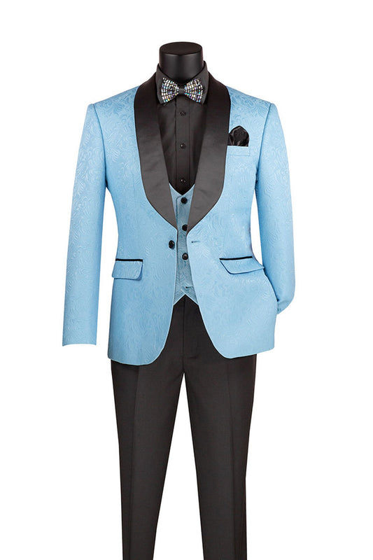 A mannequin displays the Vinci Slim Fit 3 Piece Single Button Jacquard Fabric Tuxedo in light blue, featuring black lapels from Vinci Suits. The ensemble includes a matching vest, black dress pants, a wrinkle-resistant black shirt, and is finished with a polka dot bow tie.