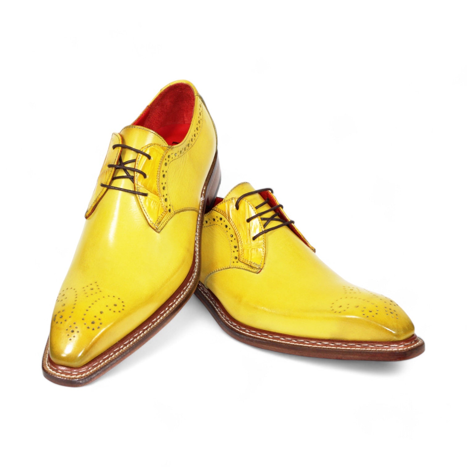 The Fennix "Tyler" Yellow Shoes by Fennix of Italy are crafted in Italy, featuring brown laces, brogue detailing, and a red interior lining.