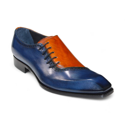 The Duca Di Matiste Veroli in Navy and Gold is an elegant two-tone oxford shoe, expertly crafted in Italy from genuine leather. It features a striking navy and gold upper, complemented by intricate stitching, a sleek black sole, and coordinated laces.