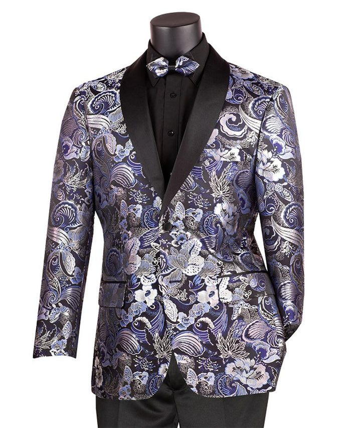 A mannequin elegantly displays a Vinci Suits ensemble, featuring the Vinci Modern Fit Paisley Pattern Jacquard Fabric Jacket with Bow Tie in Navy, complemented by black pants and a black shirt.