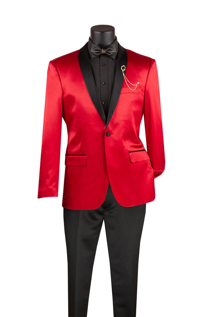 On display is the Vinci Slim Fit Sport Coat with Narrow Shawl Lapel Red BST-1 by Vinci Suits, featuring a striking red hue and contrasting black lapels. It is perfectly paired with a crisp black shirt and bow tie, adorned by an elegantly pinned decorative chain on the single-breasted jacket. This ensemble radiates style while maintaining wrinkle-resistant sophistication.