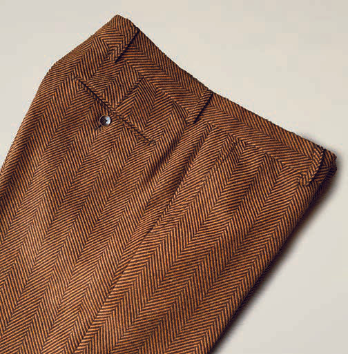 The Inserch Herringbone Pants P273-24 Chocolate, by Inserch, are crafted from a cozy wool blend and feature a button and belt loops set against a rich chocolate background.