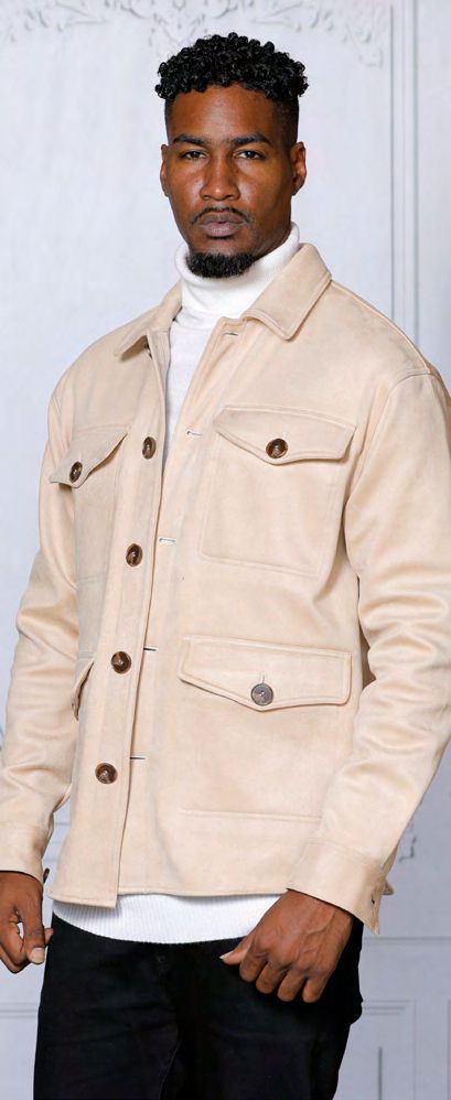 A man is standing in front of a plain background, wearing the INSOMNIA SPAIN Cream Poly Blend Button Coat from Insomnia, layered over a white turtleneck sweater.