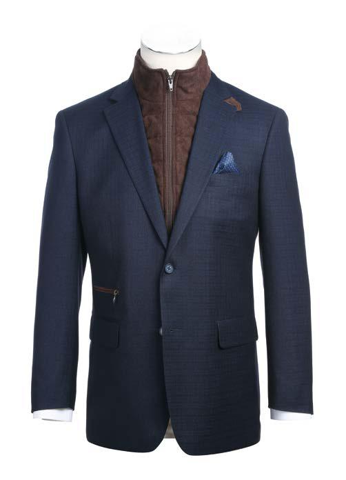 Wearing the Alessandro Vitello by Renoir Classic Fit Sport Coat 294-42, a sophisticated choice featuring side-vented tailoring in dark blue, paired with a brown quilted vest underneath that has a zippered front. The blend of polyester and spandex enhances comfort, while white shirt cuffs subtly show alongside a stylish blue pocket square in the jacket.