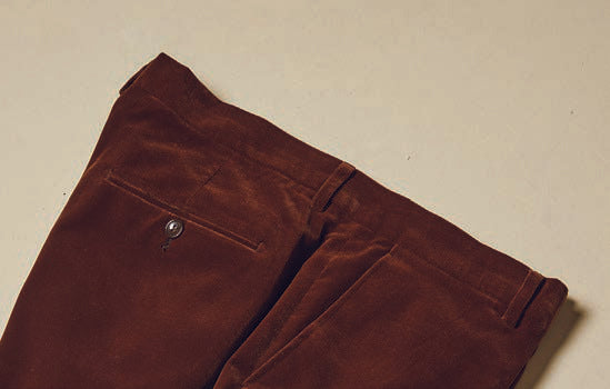 Inserch Velvet Pants P502-131 in Swiss Chocolate offer a modern fit with a visible back pocket and button, showcased on a plain background.