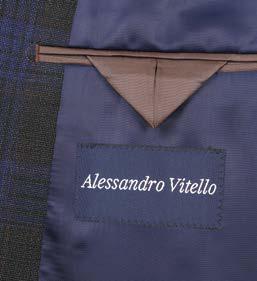 A mannequin dressed in an Alessandro Vitello New Slim Fit Sport Coat 565-12 featuring a wool, dark plaid design with a notch lapel and 2B side vents, paired with a crisp white shirt and a blue patterned tie.