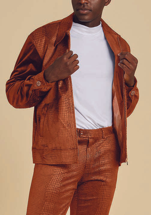 A person in the Inserch Sueded Snake Skin Embossed Jacket Suit JS268-104 Cognac, paired with a white shirt, is adjusting the jacket, revealing its elegant printed lining and regular fit.