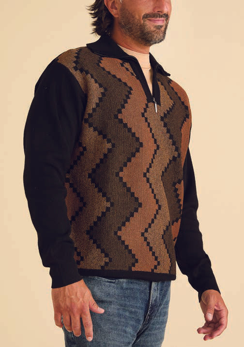 A man in an Inserch Zig-Zag Half Zip Sweater SW613-01 Black, paired with jeans, stands against a neutral background.