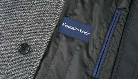 The Alessandro Vitello ALESSANDRO VITELLO Quilted Overcoat 830-12 is a gray wool coat with a high collar and five black buttons arranged vertically, complemented by a removable nylon bib for added versatility.