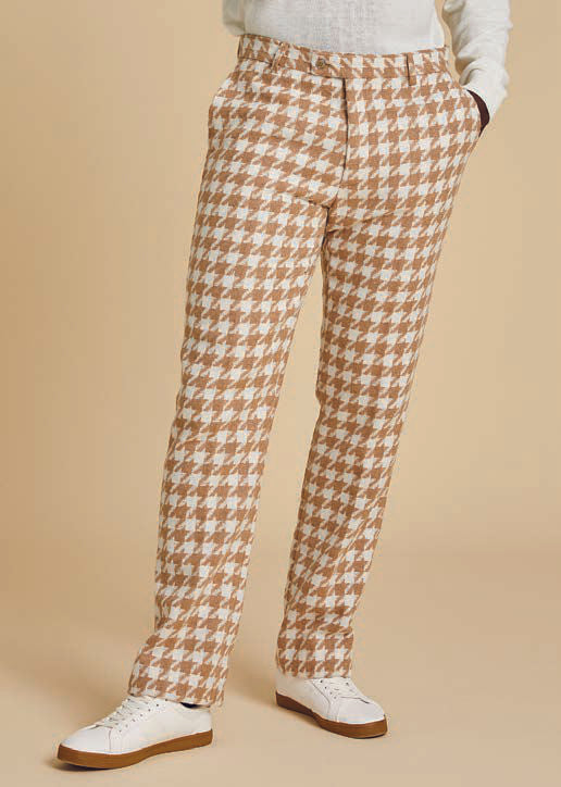 Someone is dressed in the Inserch Wool Blend Houndstooth Suit JS264B-09 Khaki, featuring a jacket and matching regular-fit pants. The outfit includes a high collar, shoulder patches, and a sleek 2-way zipper, set against a beige background.