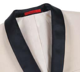 The Alessandro Vitello by Renoir 2-Piece Slim Fit Tuxedo Suit 201-3 is displayed on a mannequin, showcasing a beige tuxedo with a satin shawl lapel and a blue patterned bow tie, complemented by the 1B side-vented jacket and flat front pants for a sleek appearance.