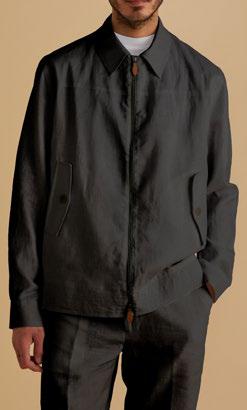 An individual dressed in the Inserch Linen Harrington Jacket Suit JS661-00001 in black, standing against a beige background.