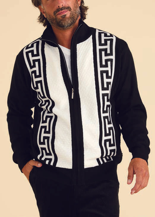 A man wearing the Inserch Grecian Full Zip Sweater SW611-01 in black, characterized by vertical Grecian geometric designs, with his hands in the pockets against a neutral background.