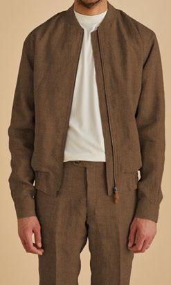 A man wearing the Inserch Linen Bomber Jacket JS660-00064 in mocha, featuring a ribbed collar, with matching pants over a white shirt.