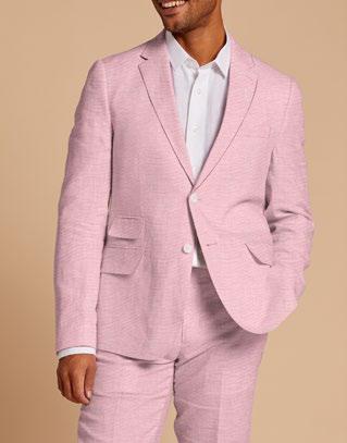 A person wearing the Inserch Slim Linen Blazer SU880-00193 in Desert Rose, along with a white shirt, stands against a beige background.