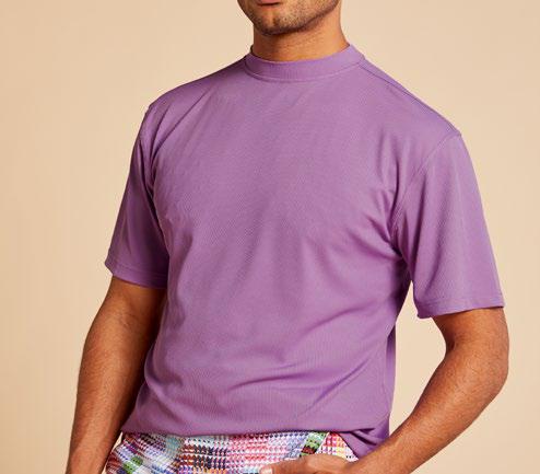 A person in a wrinkle-free, purple Inserch Short Sleeve Crewneck Rib T-Shirt stands against a beige background, wearing vibrant and breathable checkered shorts.