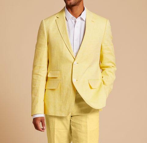 Wearing the Inserch Slim Linen Blazer SU880-00111 in Summer Yellow over a white shirt, the individual stands against a plain background, highlighting the elegance of this premium garment.