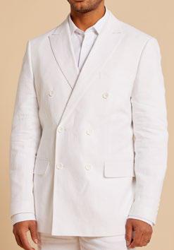 A man wearing an Inserch DB Linen Jacket BL661-00002 by Inserch, characterized by its modern tailored fit and premium linen double-breasted design, pairs it with a white shirt as he stands against a beige background.