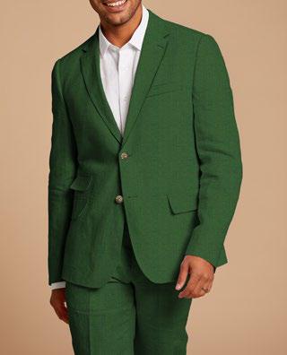 A person wearing the Inserch Slim Linen Suit SU880-00200 in emerald green over a white shirt smiles against a beige background.