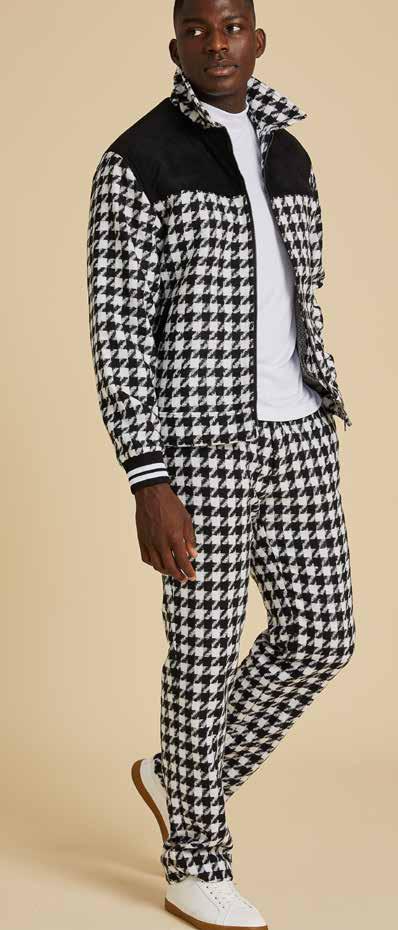 A person wearing the Inserch Wool Blend Houndstooth Suit JS264-41 in Black/White, featuring a 2-way zipper jacket and regular fit pants, stands against a neutral background.